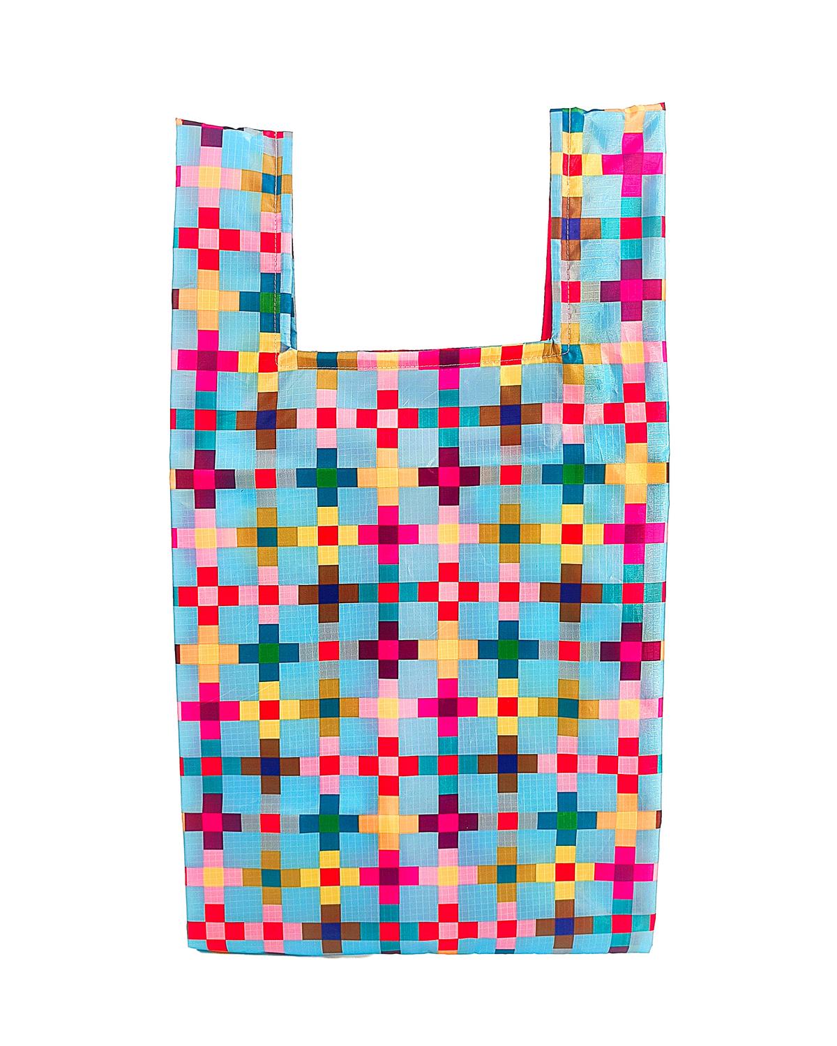 Colorful rPET shopping bag with a vibrant pixel party geometric pattern on a light blue background.