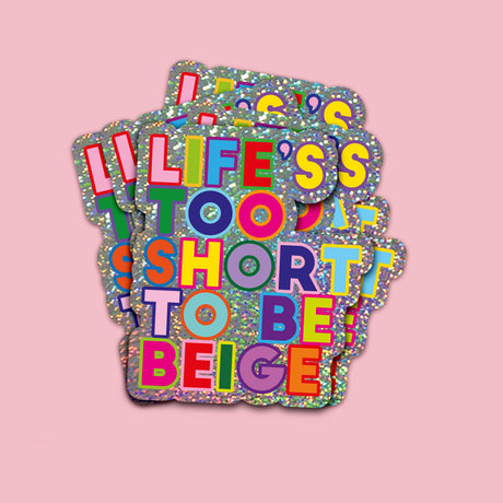 Glitter sticker met "Life's Too Short To Be Beige" in felle, kleurrijke letters.