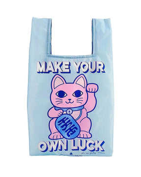 Light blue rPET shopping bag with pink Maneki Neko cat and "Make Your Own Luck" text.