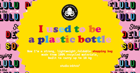 Pink rPET shopping bag with "Staying Delulu is the Solulu" text, featuring a yellow insert stating "I used to be a plastic bottle.